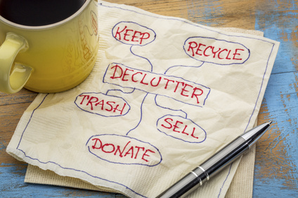 declutter on concept (keep, recycle, trash, sell, donate - handwriting on napkin with a cup of coffee
