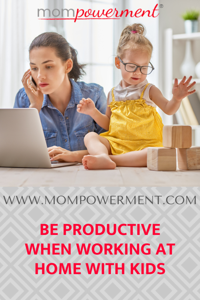 Mom on laptop with daughter playing with blocks Be Productive as a Working Mom with Kids at Home Mompowerment