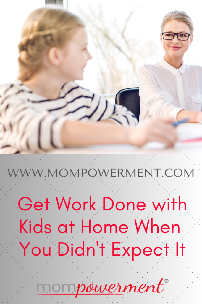 Mom working while smiling at her daughter with Get Work Done with Kids at Home When You Didn't Expect It